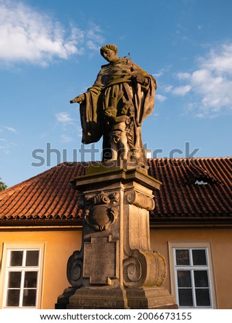 Statue of Saint Nicholas of Tolentino on Charles Bridge in Prague, Czech Republic made by Jeronym Kohl in 1708. Stock fotó © 