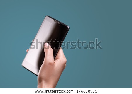 telephone in neat girl's hands, on blue background