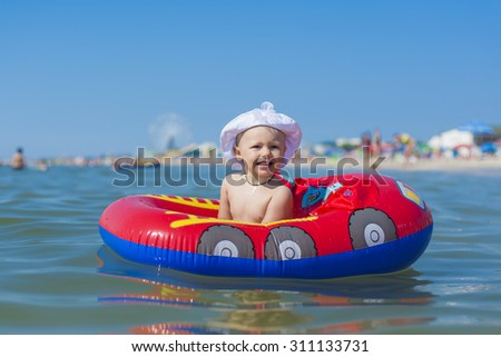 child in an inflatable boat