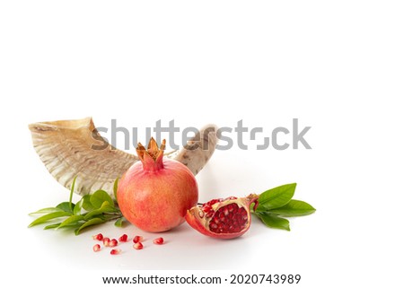 Pomegranate on white background' traditional food of jewish New Year - Rosh Hashanah. Free space for text