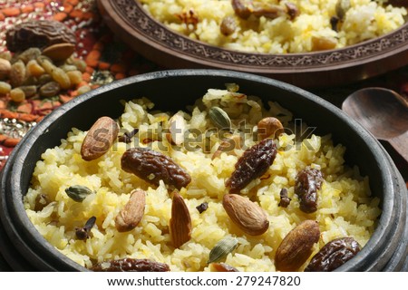 Kashmiri modur pulao made of rice cooked with sugar, water flavored with Saffron and dry fruits