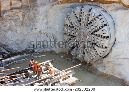Bangalore, Karnataka, India - February 25, 2013: Tunnel boring machine on construction site building metro