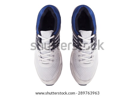 Pair of men's white sneakers on a white background, top view