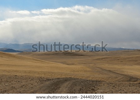 Similar – Image, Stock Photo Autumn field under cumulus clouds in sunlight