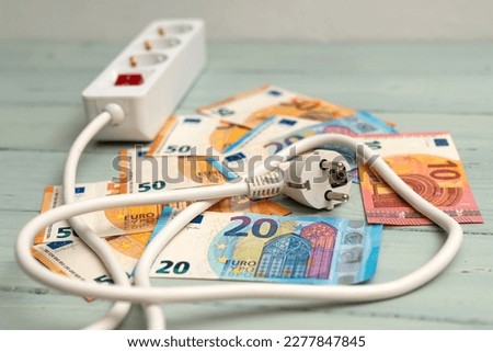 Image, Stock Photo Socket and euro bills placed in the shape of a circle. Concept of saving electricity at home. Euro banknotes. Electricity costs and expensive energy concept