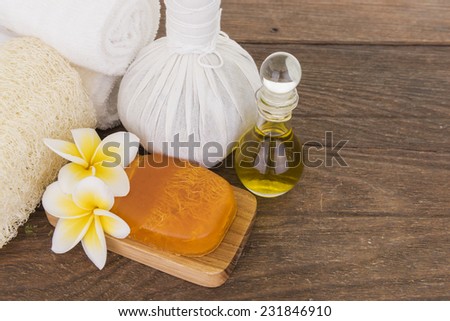 Compress with olive oil and soap in wooden backgroud, spa concept