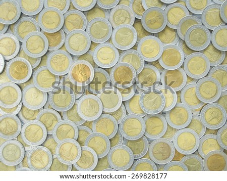 Silver metal coins used to cover the background.