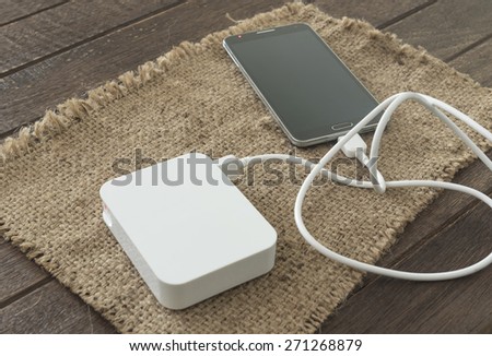 White power bank for charging mobile devices.