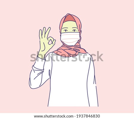 beautiful young muslim woman wearing mask doing ok sign with finger vector hand drawn illustration concept,  corona virus health protocol during ramadan and ied can use for, landing page, banner Imagine de stoc © 