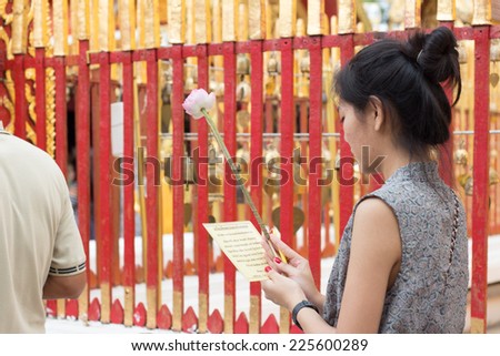 CHIANGMAI, THAILAND - JUNE 5: An unidentified woman walking meditation around the pagoda on June 5, 2014 in Chiangmai. Walking meditation is a form of meditation in action.
