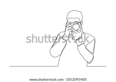 Continuous line drawing of professional man photographer take picture use camera. One line art concept of photography. Vector illustration