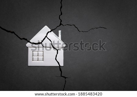 The division of the property. The destruction of the family. A broken house. Divorce and division of property. A symbol of family problems.