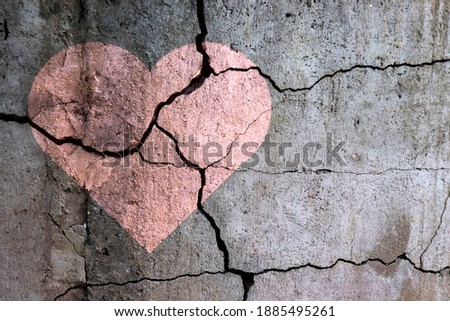 A broken heart. Drawing of a heart on a cracked wall. Broken relationships. Treason and betrayal. Past love. A quarrel. Stock foto © 