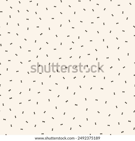 Tiny dog bone seamless vector pattern background. Neutral ditzy scattered canine food backdrop with bones. Ecru beige animal repeat for doggie and pet products. Small elements all over print