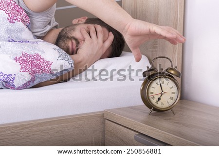 Man wakes up and he is mad at clock ringing
