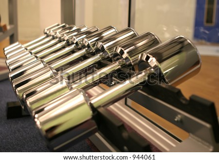 A rack of shining new weights in a gym