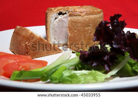 A tasty pork pie and salad