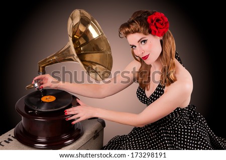 Beautiful young pin-up listens to retro gramophone PLAIN no TM