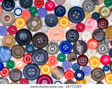 Particoloured Old-fashioned Buttons Over White Texture
