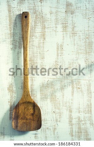 Wooden kitchenware on blue background, texture for menus and cooking needs