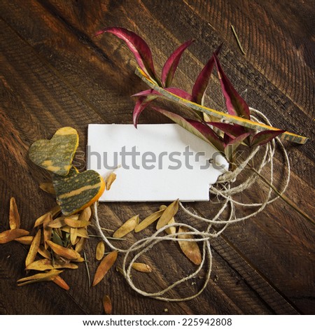 price tag label, on autumn wooden background, hearts pumpkin