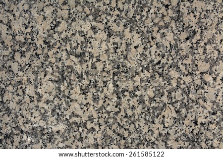 Polished granite texture with pink hues and black
