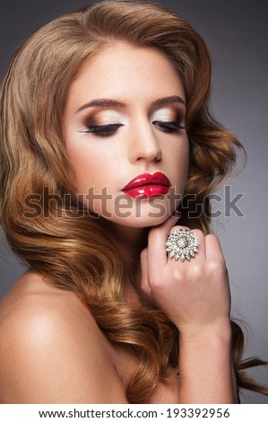Beautiful woman with red lips and long lashes
