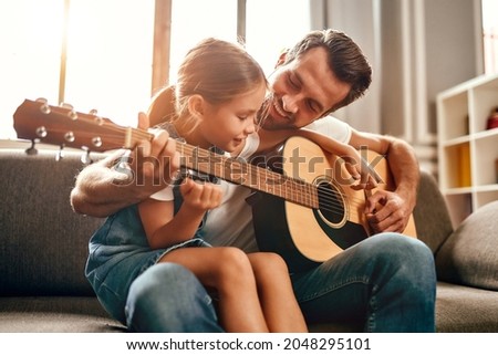 Similar – Image, Stock Photo Father playing with his little son at home