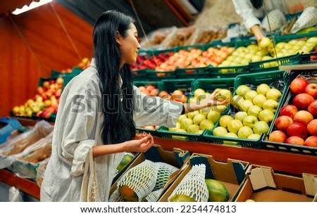 Similar – Image, Stock Photo Woman picking the vegetables in a garden