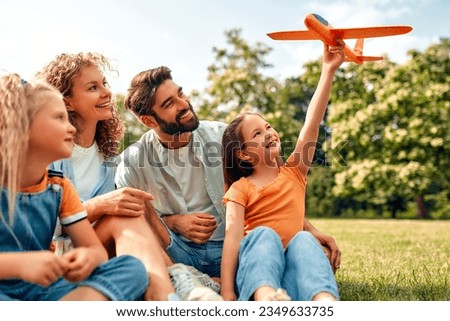 Similar – Image, Stock Photo Young family having a ride with cargo bike