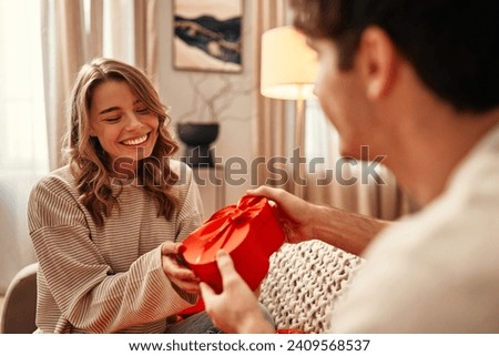 Similar – Image, Stock Photo valentines day. happy family, mom, dad and little daughter in white t-shirts holding hand made red hearts in their hands looking at the camera on white background. happiness, health and love concept