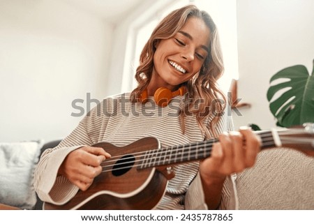 Similar – Image, Stock Photo Woman playing guitar in field with dry vegetation