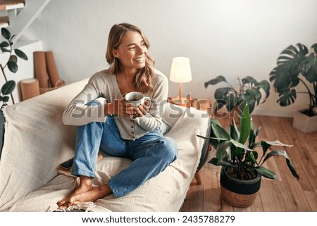 Similar – Image, Stock Photo Woman drinking coffee and on the mobile phone in airport