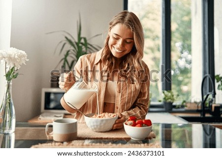 Similar – Image, Stock Photo Woman pouring fresh milk from bottle to enamel mug while having refreshment in garden