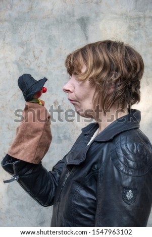 Similar – Image, Stock Photo Portrait of an eccentric rocker man with long purple hair in a green bathroom.