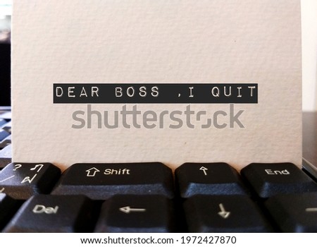 Card on keyboard typed DEAR BOSS I QUIT, concept of employee making decision to quit corporate day job , unhappy worker giving up working 9 to 5 , change job or start their own business Stock foto © 