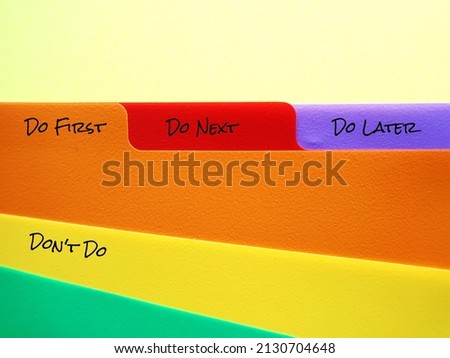 Document folder with tags labels DO FIRST DO NEXT DO LATER DON'T DO, concept of time management skills, knowing priority of tasks, difference between important and urgent tasks Stok fotoğraf © 