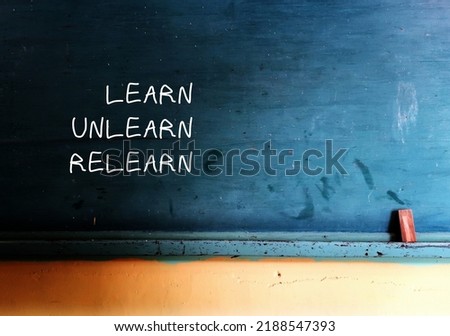 Vintage school chalkboard with handwritten text Learn Unlearn Relearn - concept of knowing to discard learned outdated knowledge or skills or fake information and ready to relearn new ones Foto stock © 