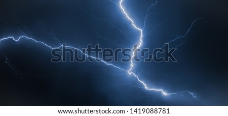 branched lightning over the settlement, the storm front approaches