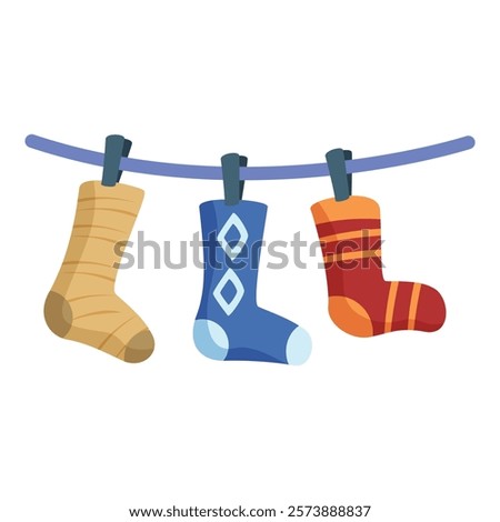 Three colorful socks are hanging on a clothesline, drying after being washed