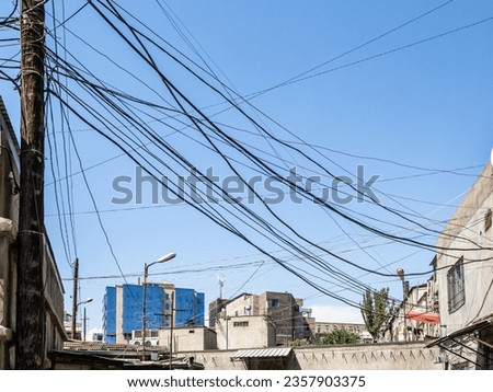 Similar – Image, Stock Photo over the roofs street lights and wild sky