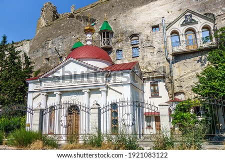 Panorama of Inkerman Cave Monastery complex. Building on front is Church of St Pantaleon. Behind is Cave Church of St Clement. Ruins on cliff are medieval fortress Kalamita. Shot in Inkerman, Crimea Zdjęcia stock © 