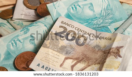 Real currency, money from Brazil. Dinheiro, Reais, Real Brasileiro, Brasil. A Brazilian banknotes in close up.