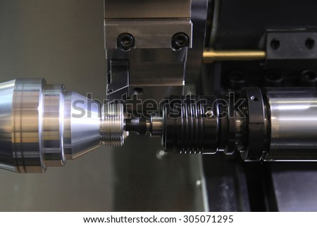 industrial metal work bore machining process by cutting tool on automated lathe