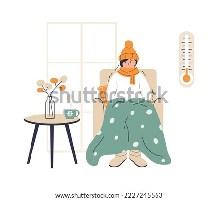Young woman wrapped in plaid. Low house temperature and thermometer on wall. Person freezes from cold warming up with hot drink. Young woman sitting in armchair, shivering from cold.  Foto stock © 