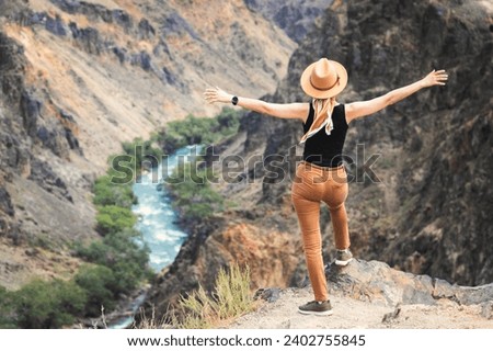 Similar – Picturesque view of water surface near amazing rock hills at sunset and blue sky