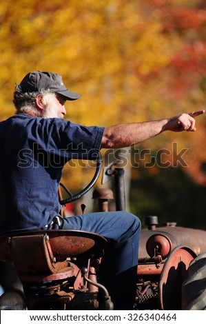 A New Hampshire farmer sits on his tractor at the Sandwich Fair in Sandwich, New Hampshire, USA, on October 11, 2015.