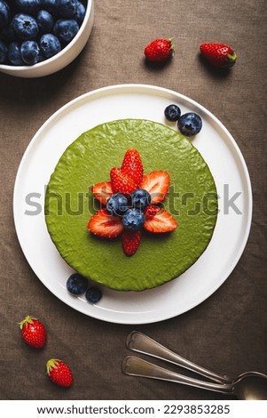 Similar – Image, Stock Photo Matcha cheesecake flat lay. Woman hands taking cake slice