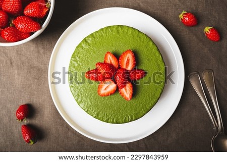 Similar – Image, Stock Photo Matcha cheesecake flat lay. Woman hands taking cake slice