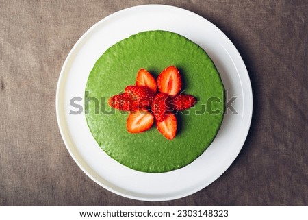 Similar – Image, Stock Photo Matcha cheesecake flat lay. Woman hands taking cake slice